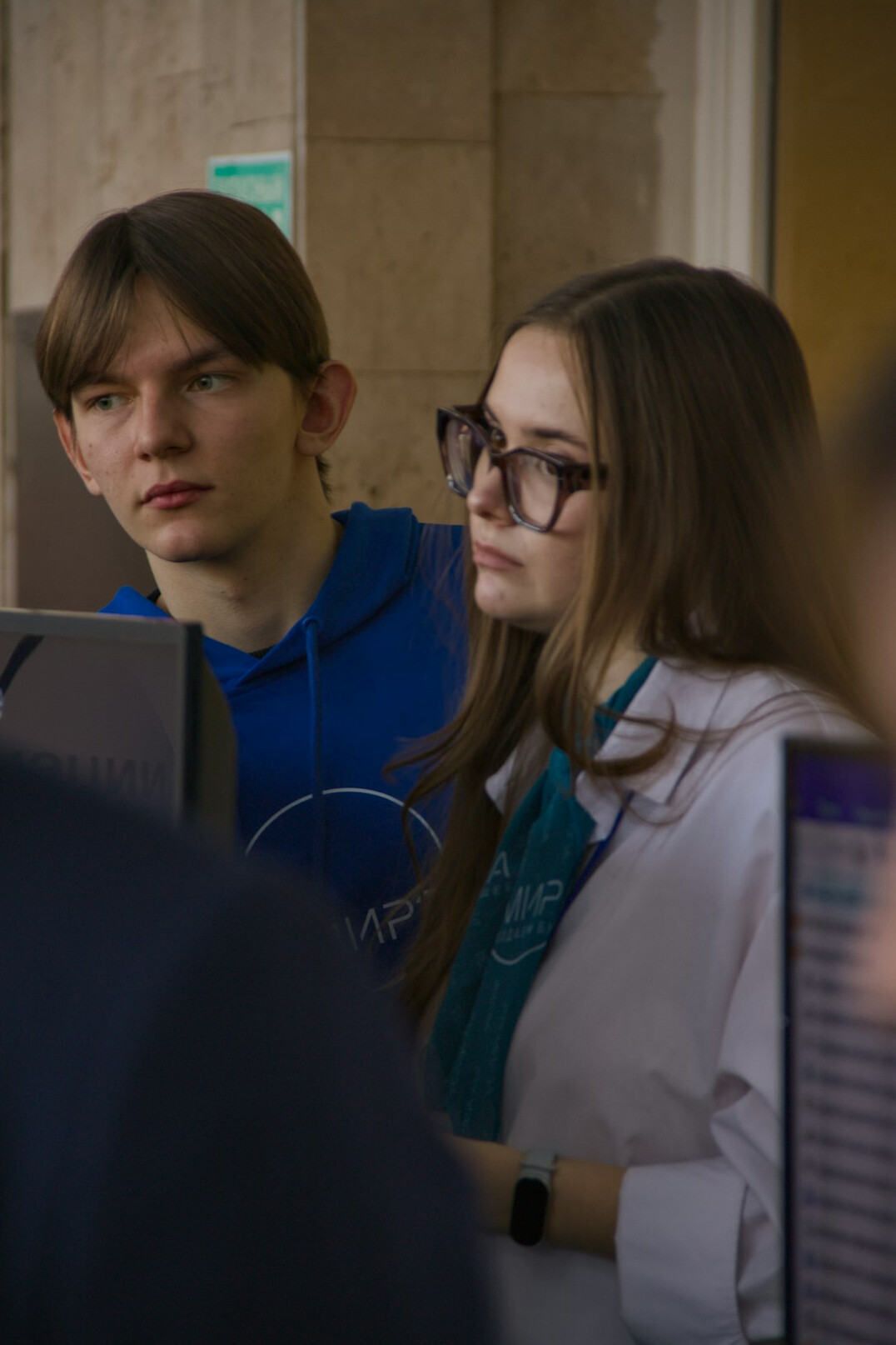 students coding together in class