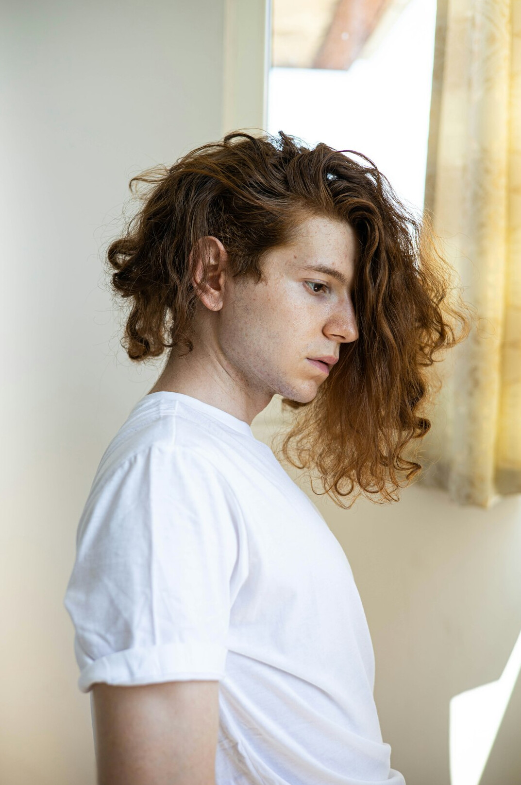 Portrait of a young Croatian man with curly hair