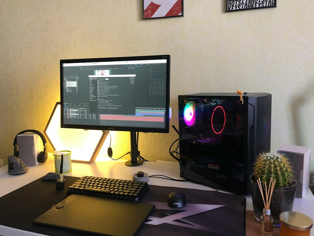 Desk workspace with laptop showing code editor